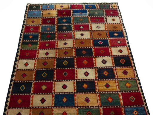 Surface texture of 2000s Persian Gabbeh rug with natural Wool and intricate pattern