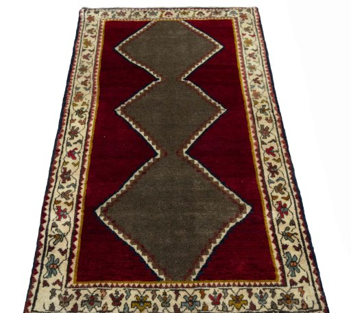 Surface texture of 2000s Persian Gabbeh rug with natural Wool and intricate pattern