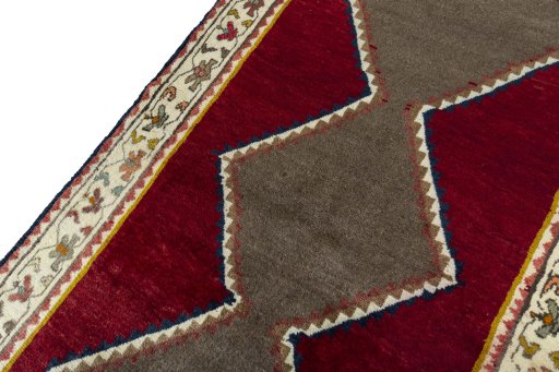 Backside of handmade 2000s Persian Gabbeh rug showing knot structure and weave density
