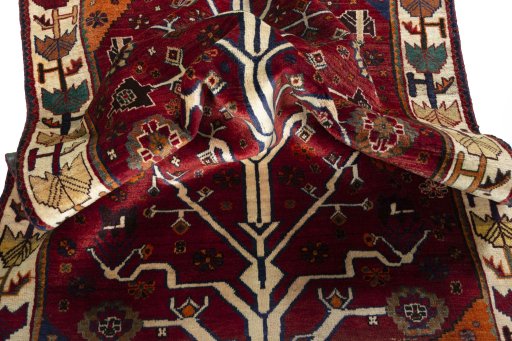 Corner detail of 2000s Persian Gabbeh rug showing border pattern and Wool pile