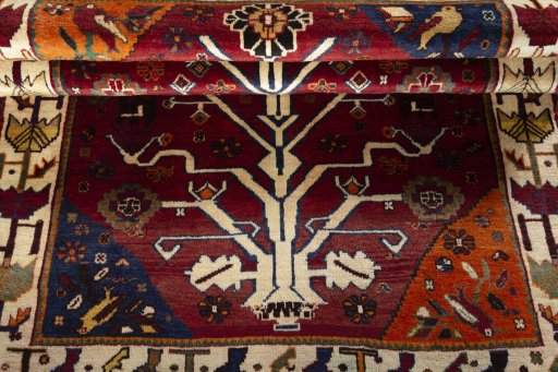 Full view of 2000s Persian Gabbeh rug from Iran / Persia, 192 × 121 cm in Red tones