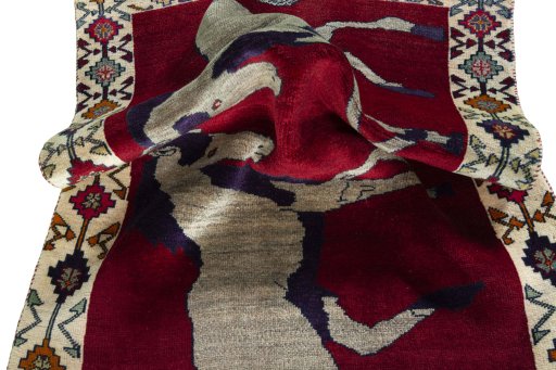 Corner detail of 2000s Persian Gabbeh rug showing border pattern and Wool pile