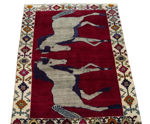 Surface texture of 2000s Persian Gabbeh rug with natural Wool and intricate pattern