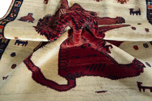 Corner detail of 2000s Persian Gabbeh rug showing border pattern and Wool pile