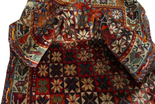 Corner detail of 1970s Persian Gabbeh rug showing border pattern and Wool pile