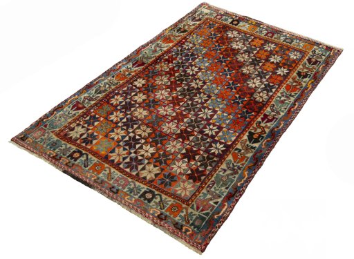 Corner detail of 1970s Persian Gabbeh rug showing border pattern and Wool pile