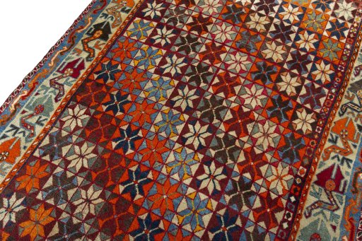 Backside of handmade 1970s Persian Gabbeh rug showing knot structure and weave density