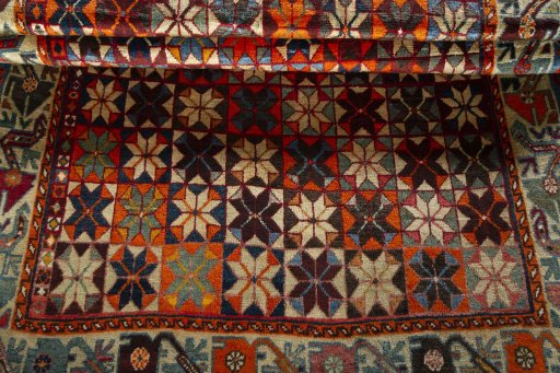 Full view of 1970s Persian Gabbeh rug from Iran / Persia, 225 × 135 cm in Multi Color tones