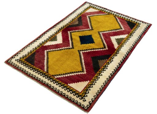 Corner detail of 2000s Persian Gabbeh rug showing border pattern and Wool pile