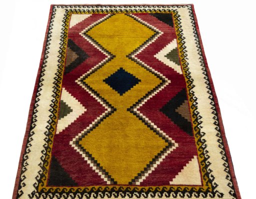 Surface texture of 2000s Persian Gabbeh rug with natural Wool and intricate pattern