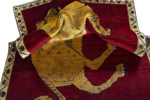 Corner detail of 2000s Persian Gabbeh rug showing border pattern and Wool pile