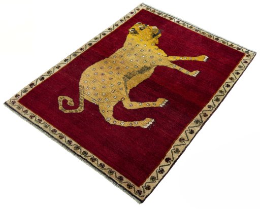 Corner detail of 2000s Persian Gabbeh rug showing border pattern and Wool pile