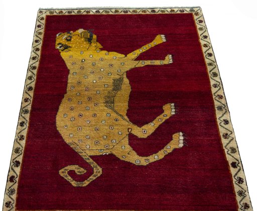 Surface texture of 2000s Persian Gabbeh rug with natural Wool and intricate pattern