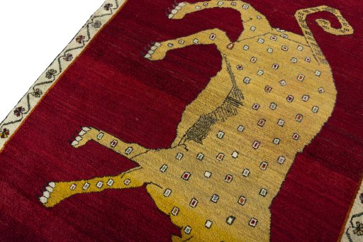 Backside of handmade 2000s Persian Gabbeh rug showing knot structure and weave density
