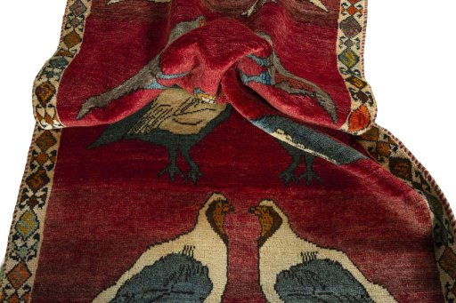 Corner detail of 2000s Persian Gabbeh rug showing border pattern and Wool pile