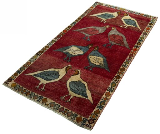 Corner detail of 2000s Persian Gabbeh rug showing border pattern and Wool pile