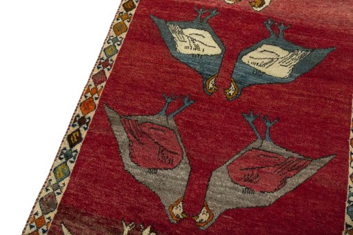 Backside of handmade 2000s Persian Gabbeh rug showing knot structure and weave density