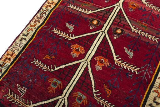 Backside of handmade 2000s Persian Gabbeh rug showing knot structure and weave density