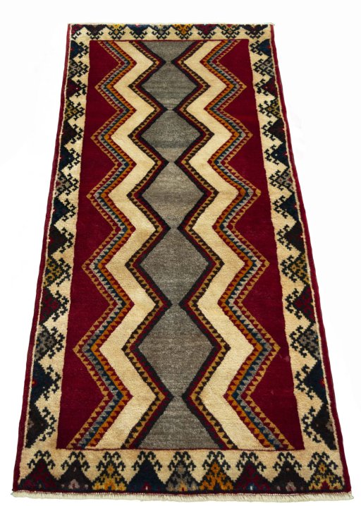 Surface texture of 2000s Persian Gabbeh rug with natural Wool and intricate pattern