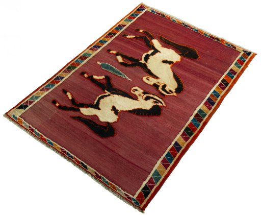Corner detail of 2000s Persian Gabbeh rug showing border pattern and Wool pile