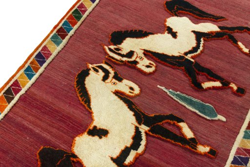 Backside of handmade 2000s Persian Gabbeh rug showing knot structure and weave density