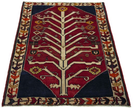 Surface texture of 2000s Persian Gabbeh rug with natural Wool and intricate pattern