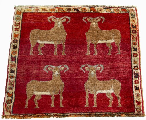 Surface texture of 2000s Persian Gabbeh rug with natural Wool and intricate pattern