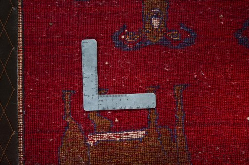 Backside of handmade 2000s Persian Gabbeh rug showing knot structure and weave density