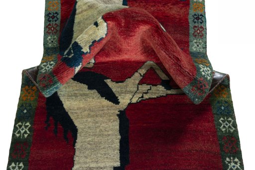 Corner detail of 2000s Persian Gabbeh rug showing border pattern and Wool pile