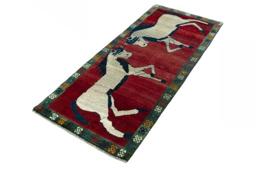 Corner detail of 2000s Persian Gabbeh rug showing border pattern and Wool pile