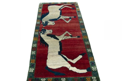Surface texture of 2000s Persian Gabbeh rug with natural Wool and intricate pattern