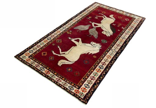 Corner detail of 2000s Persian Gabbeh rug showing border pattern and Wool pile