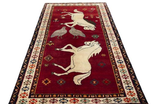 Surface texture of 2000s Persian Gabbeh rug with natural Wool and intricate pattern