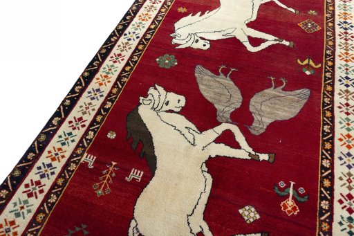 Backside of handmade 2000s Persian Gabbeh rug showing knot structure and weave density