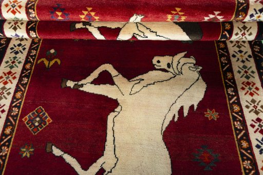 Full view of 2000s Persian Gabbeh rug from Iran / Persia, 281 × 154 cm in Red tones