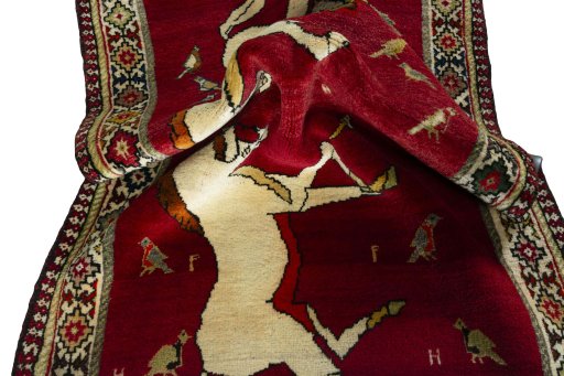 Corner detail of 2000s Persian Gabbeh rug showing border pattern and Wool pile