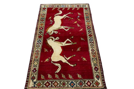 Surface texture of 2000s Persian Gabbeh rug with natural Wool and intricate pattern