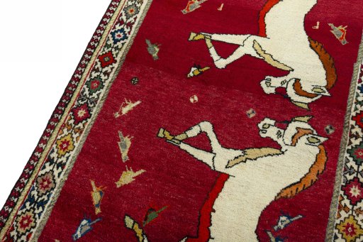 Backside of handmade 2000s Persian Gabbeh rug showing knot structure and weave density