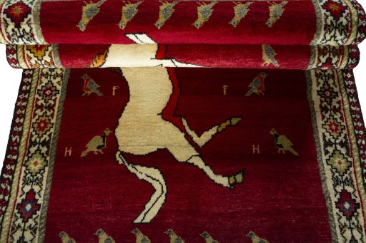 Full view of 2000s Persian Gabbeh rug from Iran / Persia, 204 × 107 cm in Red tones