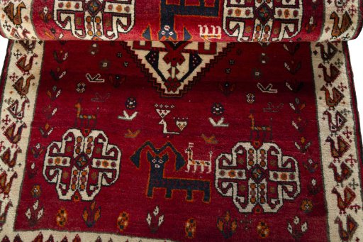 Corner detail of 2000s Persian Gabbeh rug showing border pattern and Wool pile