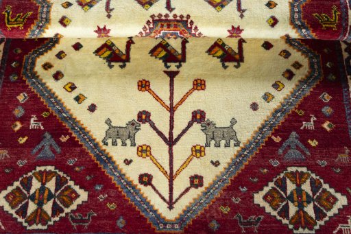 Corner detail of 2000s Persian Gabbeh rug showing border pattern and Wool pile