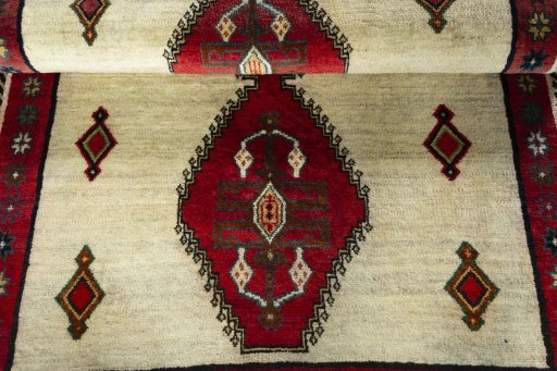 Full view of 2000s Persian Gabbeh rug from Iran / Persia, 150 × 108 cm in Beige tones