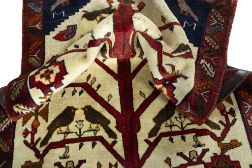 Corner detail of 2000s Persian Gabbeh rug showing border pattern and Wool pile