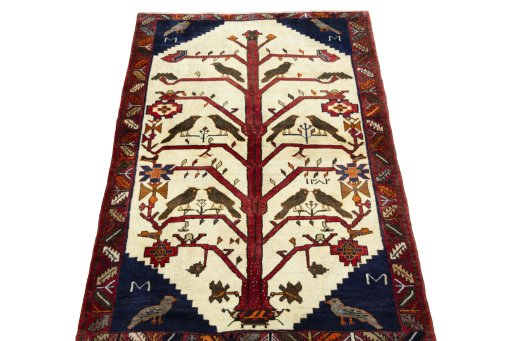 Surface texture of 2000s Persian Gabbeh rug with natural Wool and intricate pattern