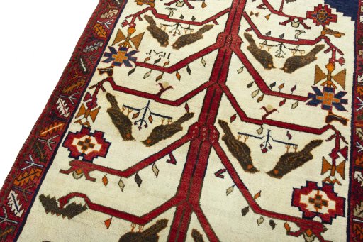 Backside of handmade 2000s Persian Gabbeh rug showing knot structure and weave density