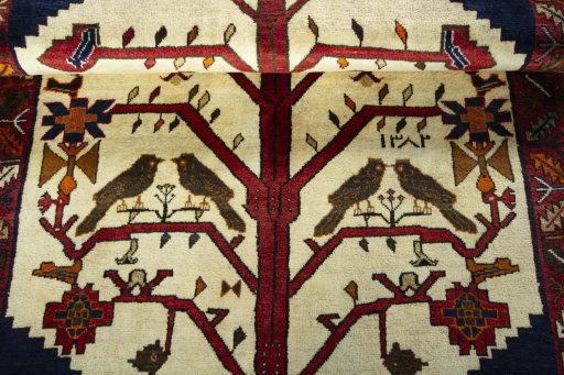 Full view of 2000s Persian Gabbeh rug from Iran / Persia, 180 × 112 cm in Beige tones