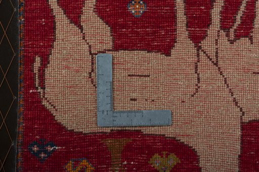 Backside of handmade 2000s Persian Gabbeh rug showing knot structure and weave density