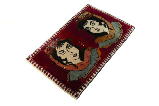 Corner detail of 2000s Persian Gabbeh rug showing border pattern and Wool pile