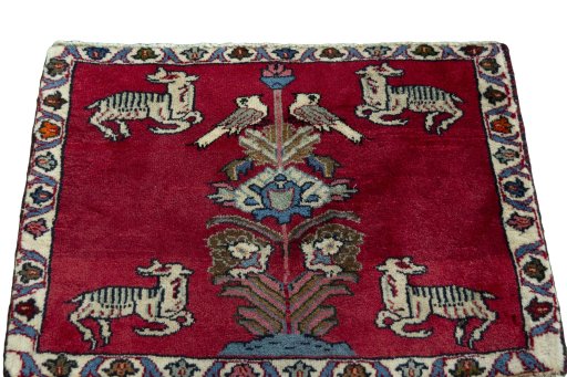Surface texture of 2000s Persian Gabbeh rug with natural Wool and intricate pattern