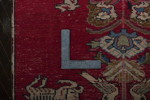 Backside of handmade 2000s Persian Gabbeh rug showing knot structure and weave density